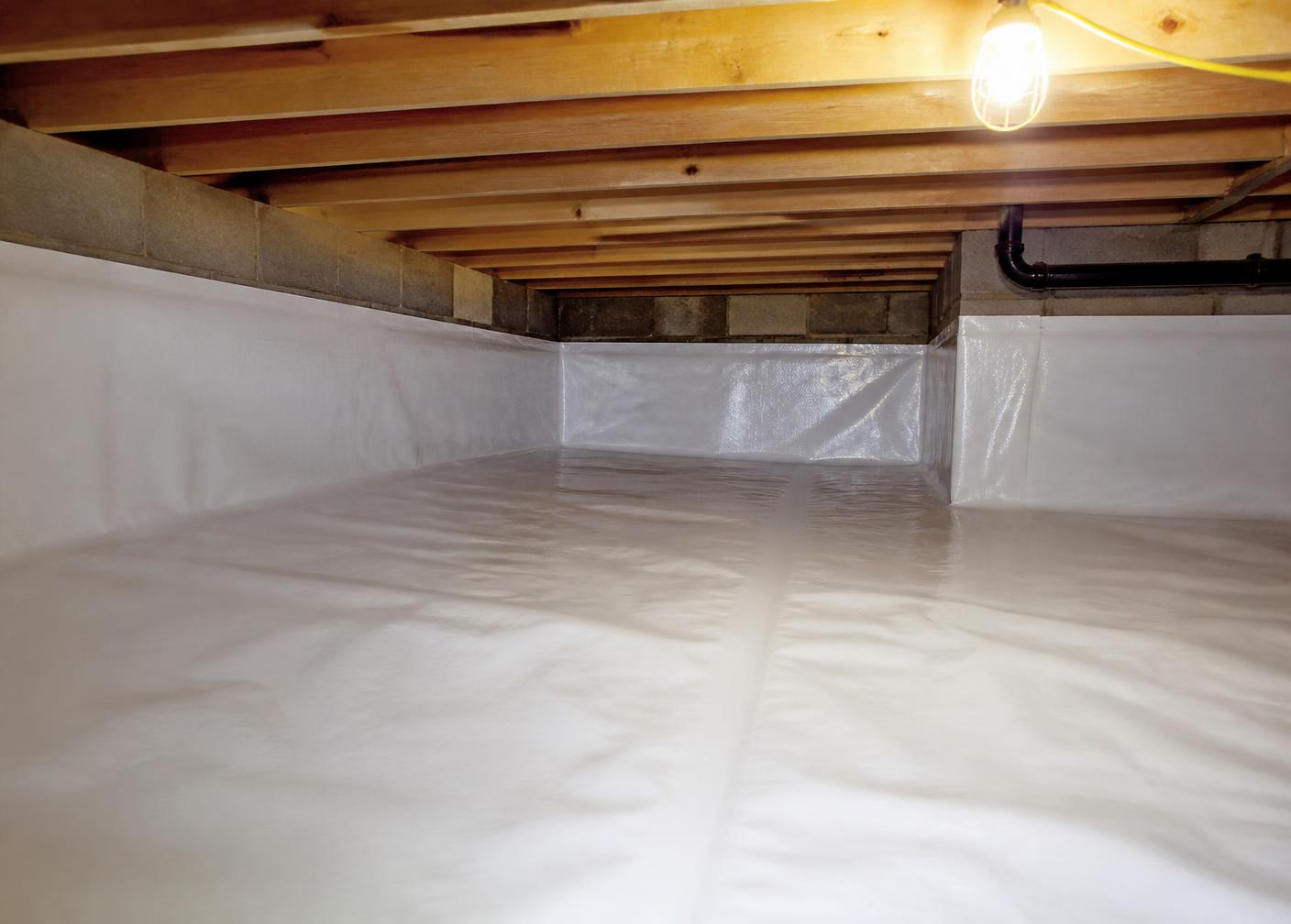Completed crawlspace with a clean vapor barrier installed across the ground and foundation walls
