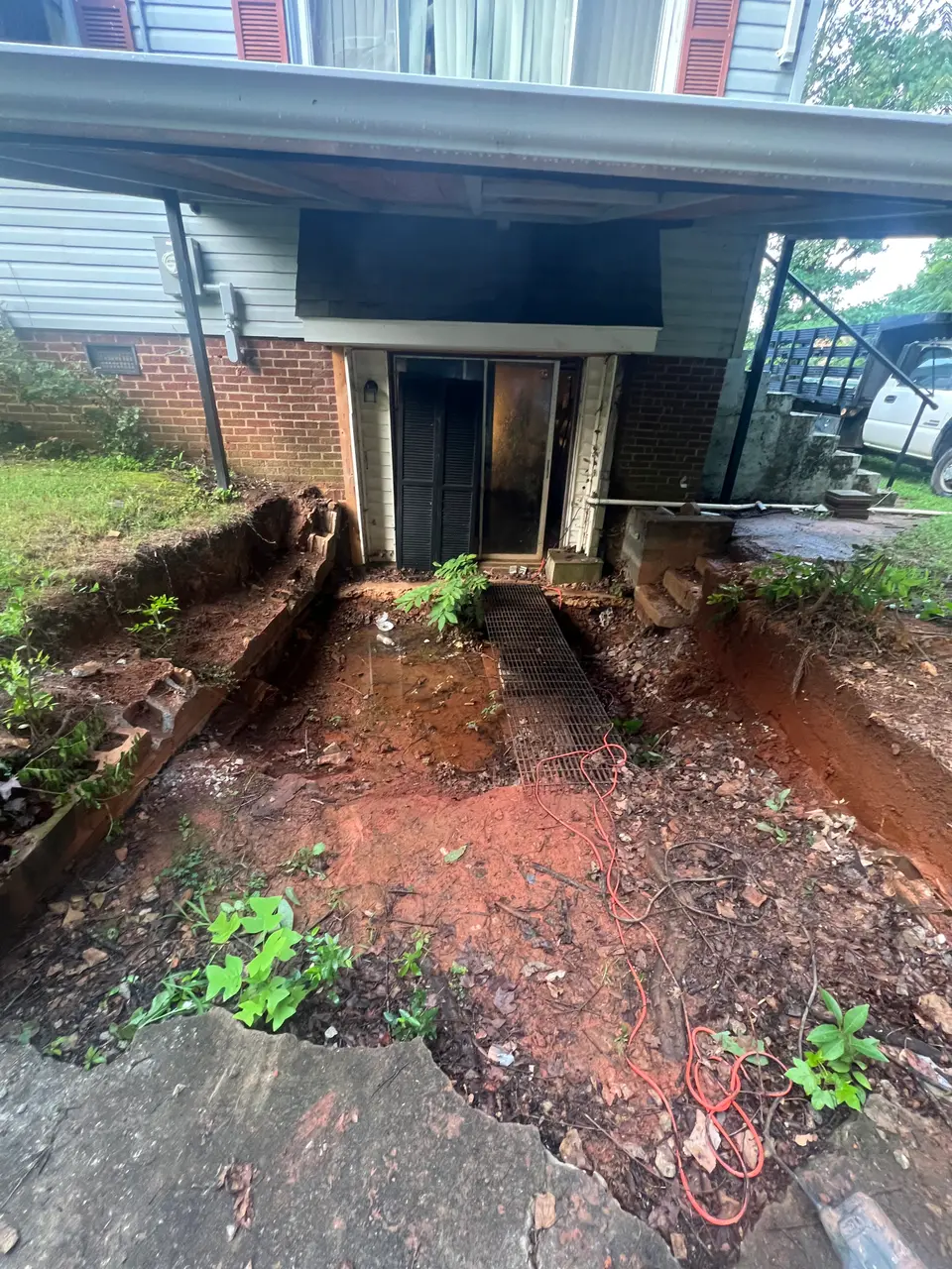 Additional view of the backyard behind the home before renovation work began